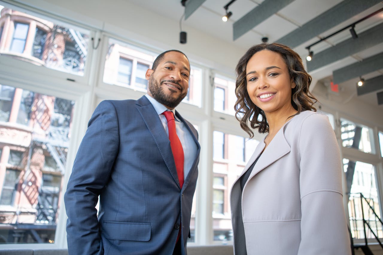 Crafting Captivating Headlines: Your awesome post title goes here Business professionals smiling in a modern Detroit office setting.